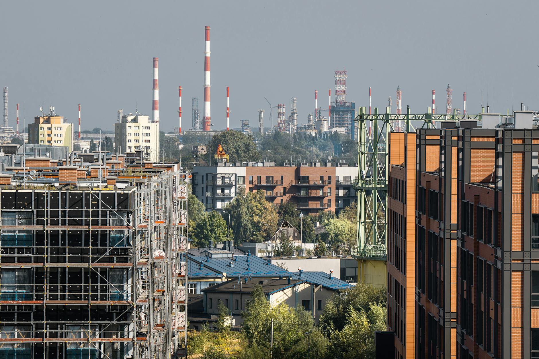 Cityscape featuring development and industrial chimneys in Gdansk.