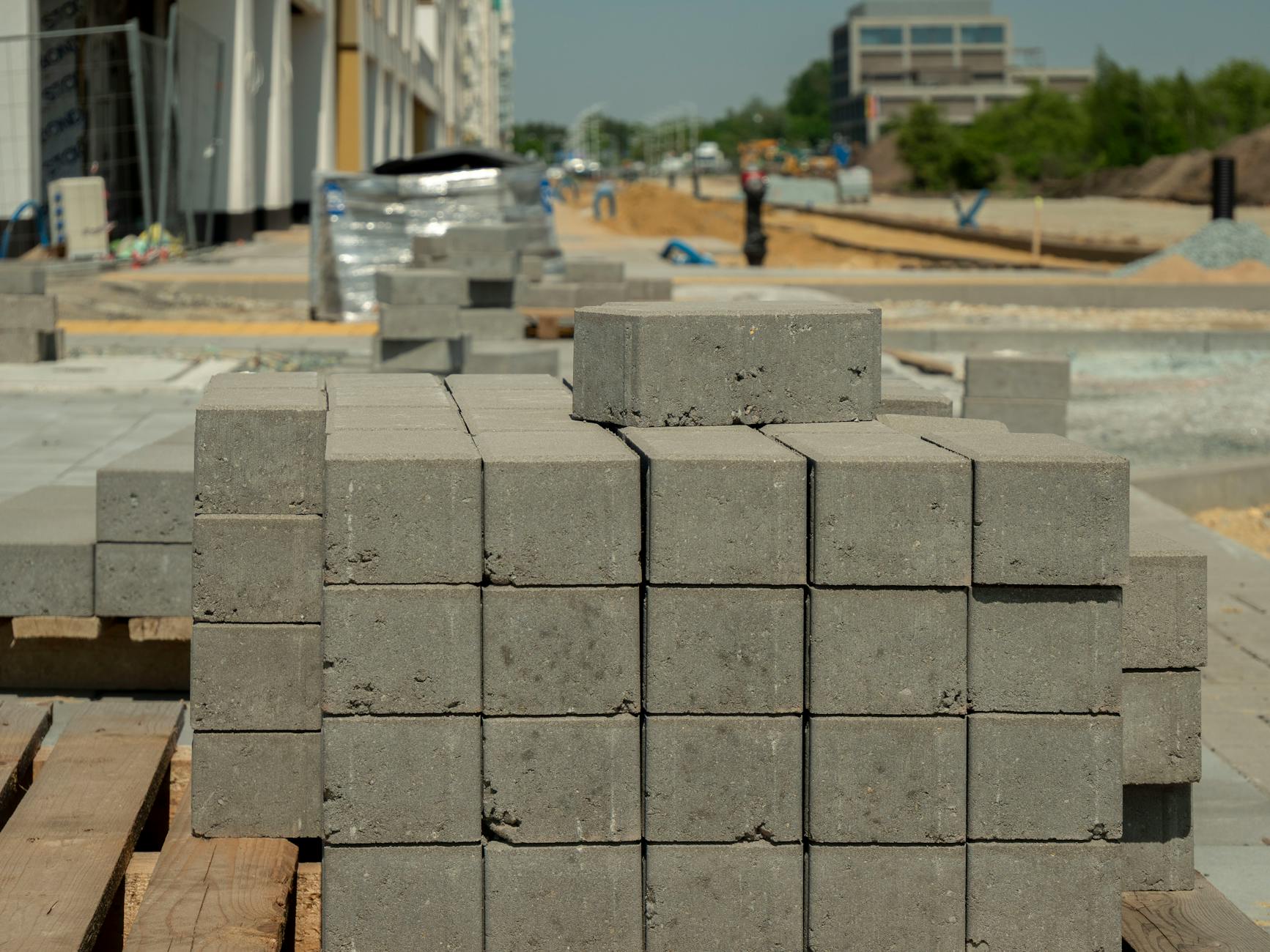 Concrete blocks stacked at a construction site in Wrocław, Poland, showcasing urban development.