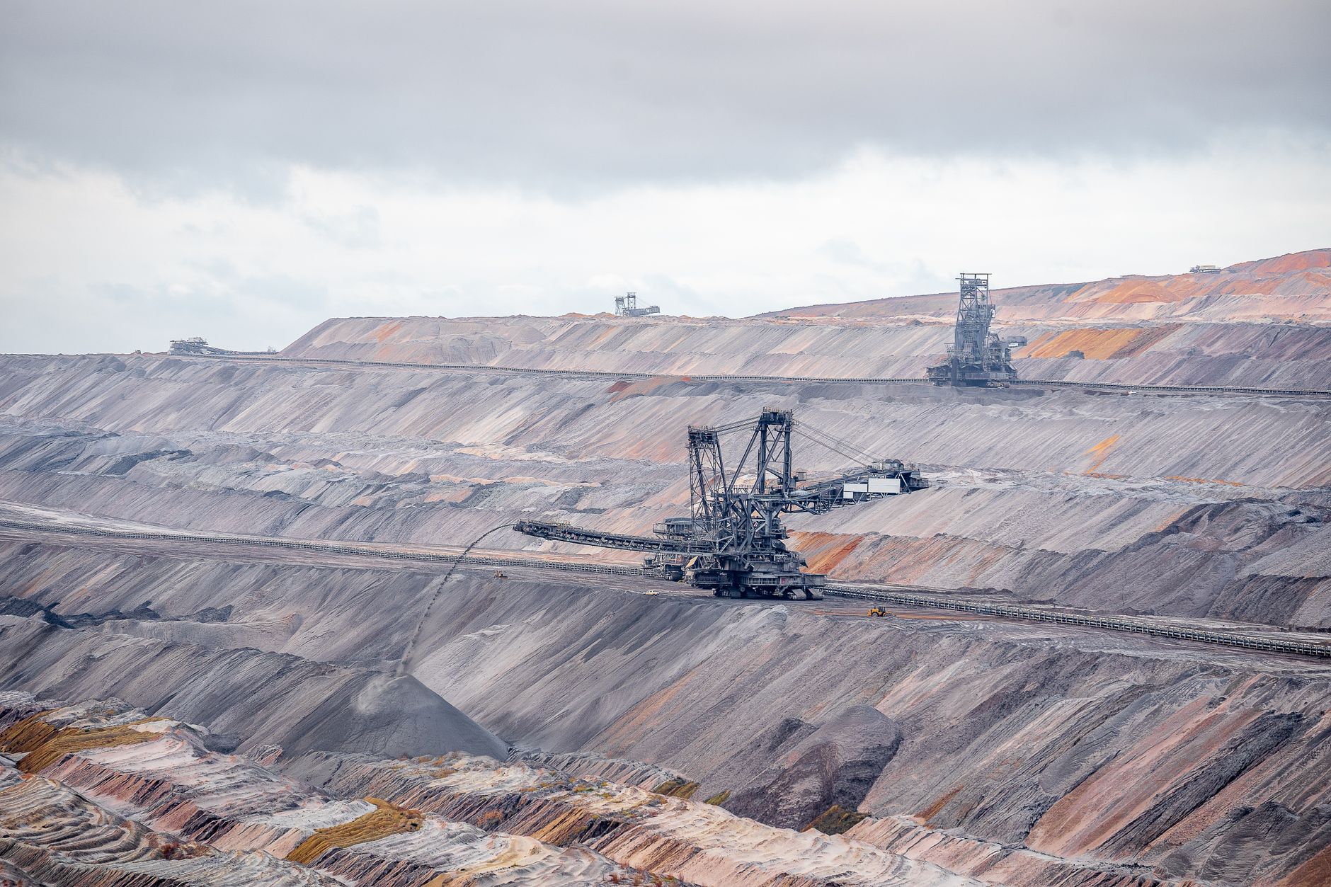 Aerial view of bucket-wheel excavators in an expansive open-pit coal mine.