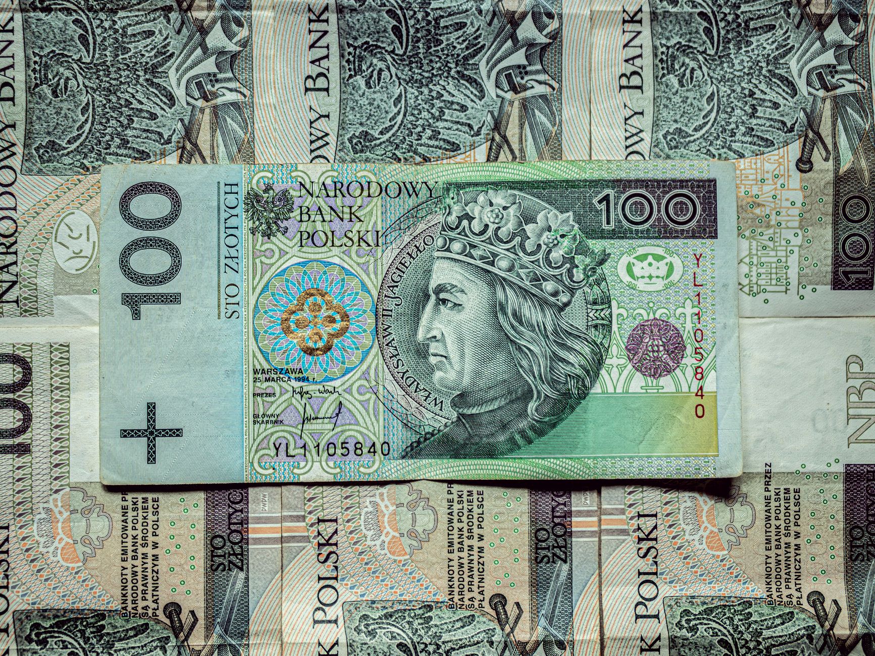 Detailed view of Polish 100 Zloty banknotes displaying King Władysław II Jagiełło.