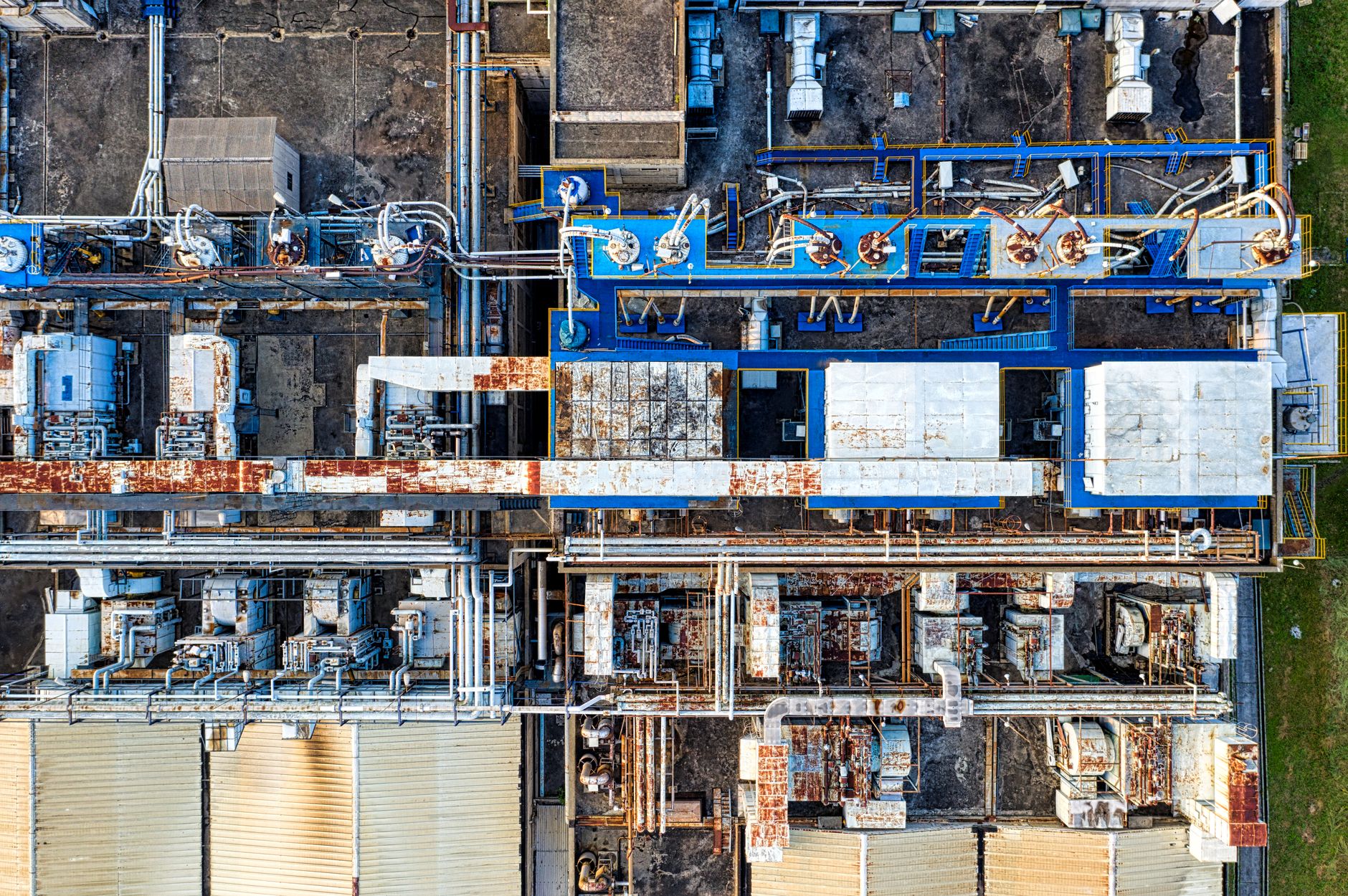 Aerial view of modern industrial factory with buildings and various special equipments in daytime
