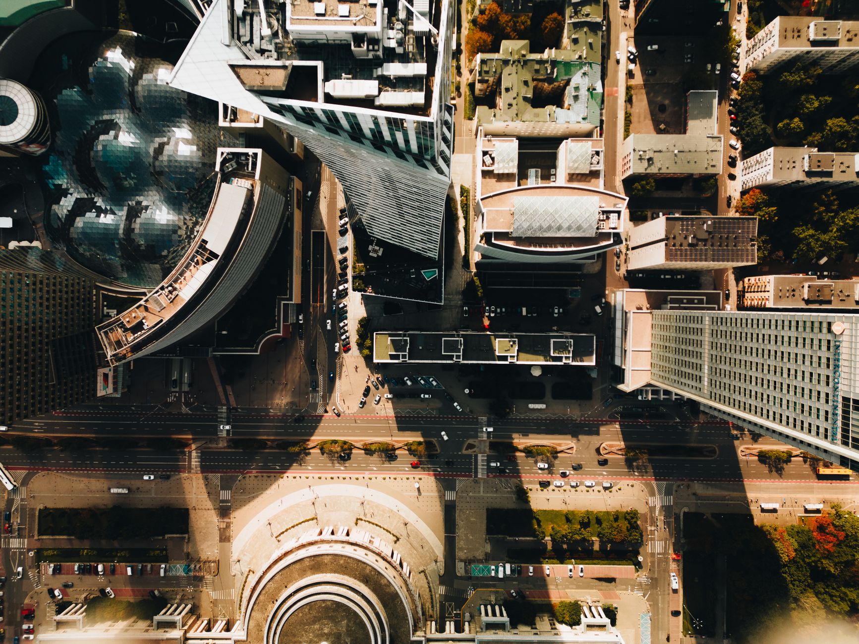 A striking aerial view of modern skyscrapers in Warsaw, Poland, showcasing urban architecture.